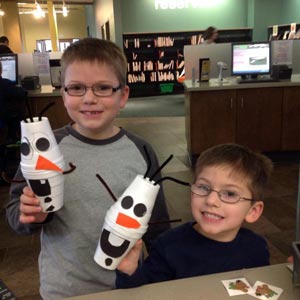 Children building Olaf dolls